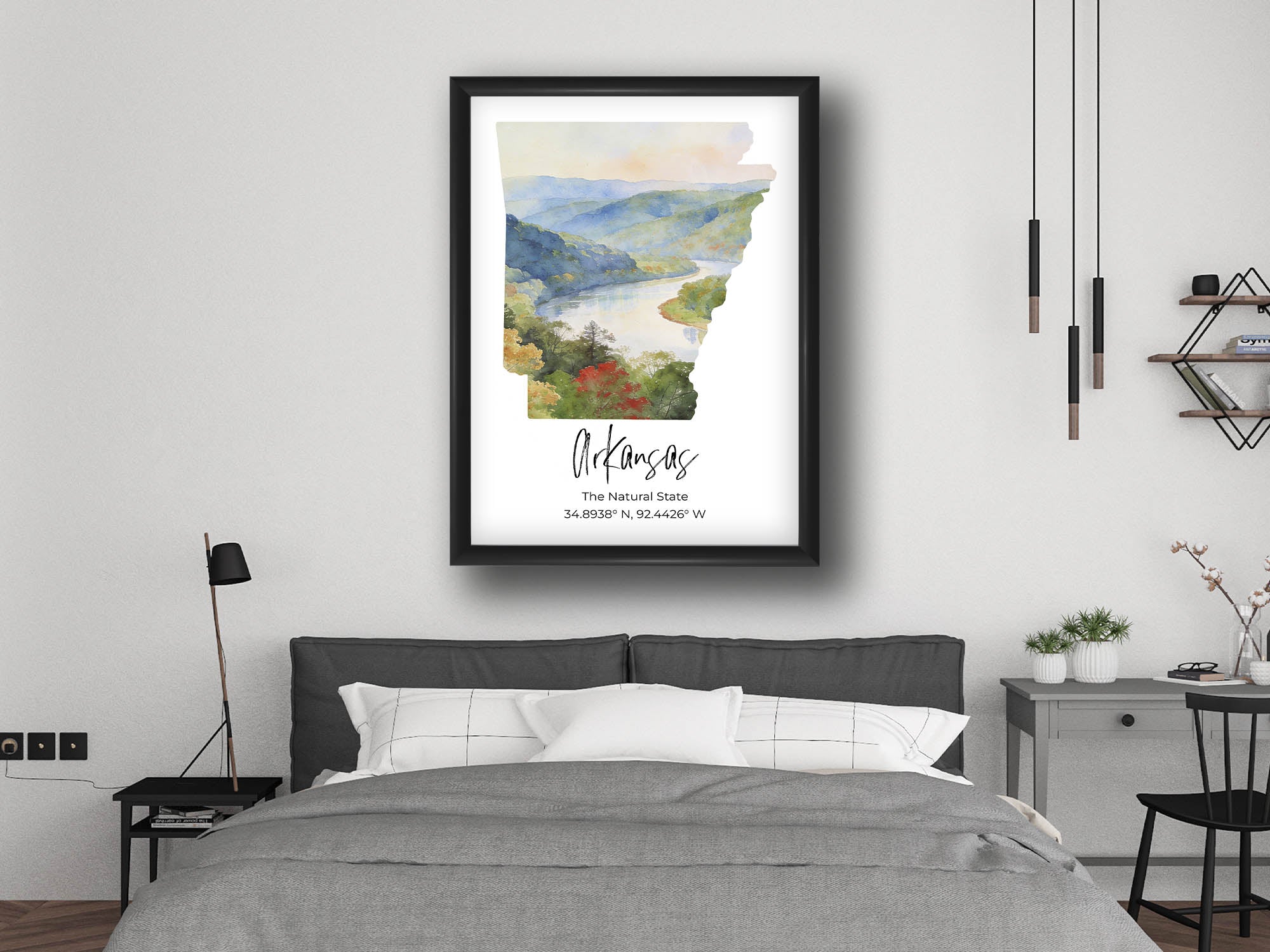 Arkansas watercolor state map with Ozarks wall art print in black frame styled above a bed in a bright bedroom