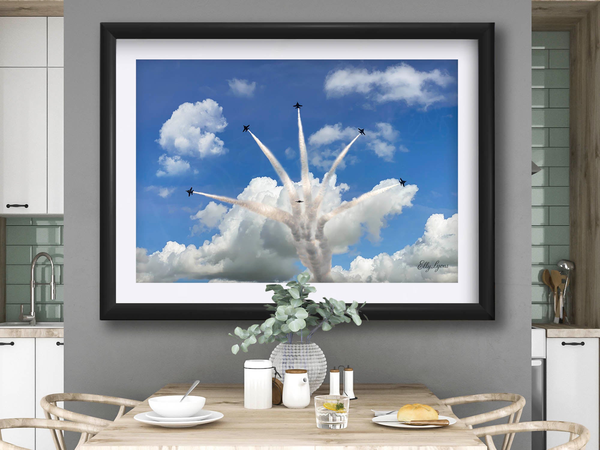 Blue Angels jets delta burst fine art print in black frame styled above a table and chairs in a bright dining room