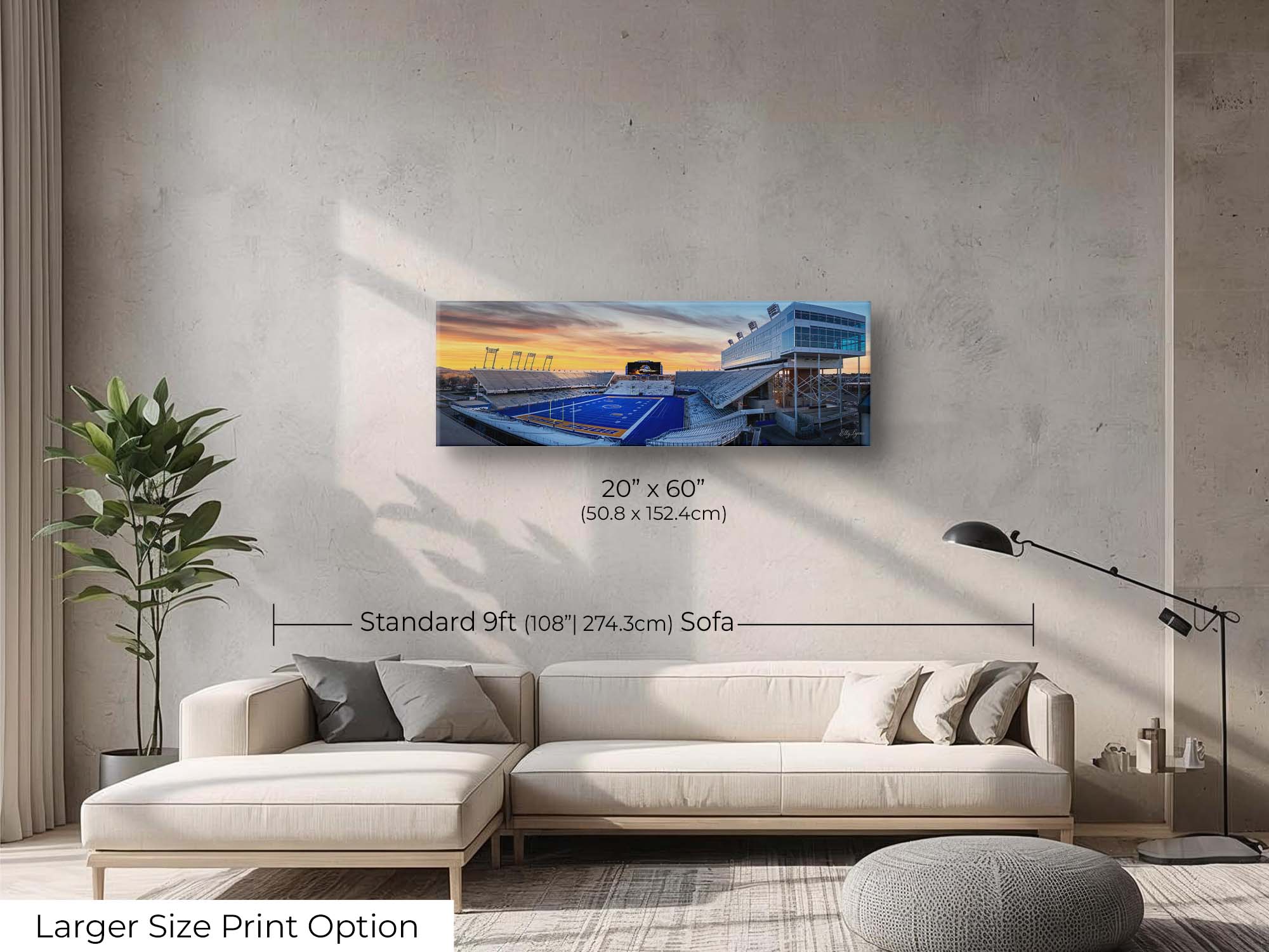 BSU Broncos stadium, blue turf sunset fine art print wall art size mockup showing a 20x60 inch print above a nine foot sofa