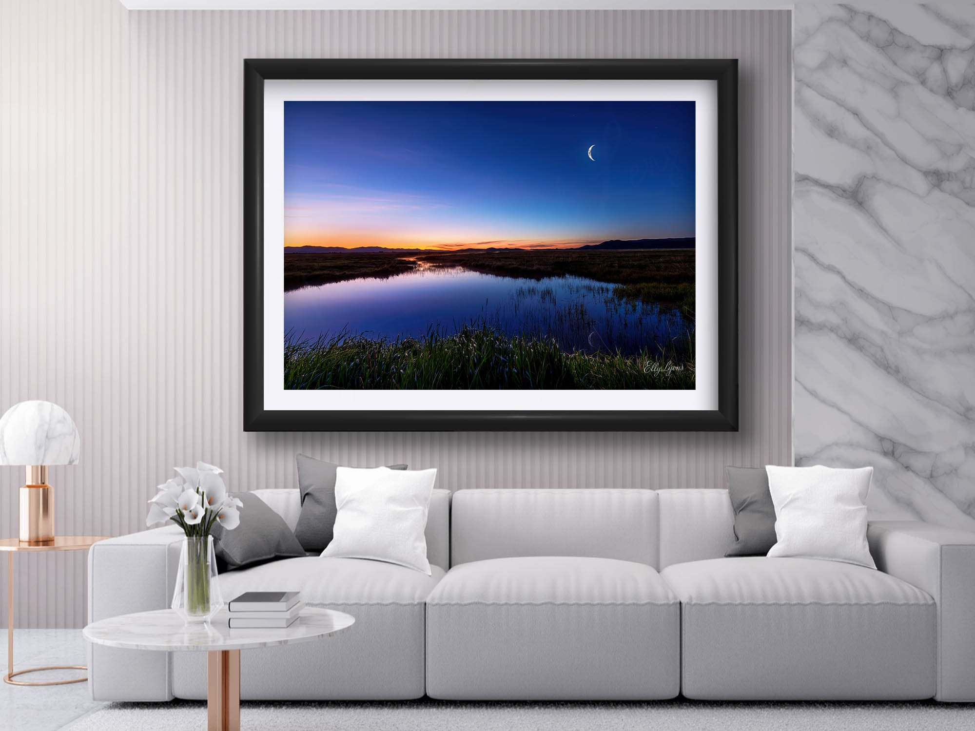 Camas Prairie Marsh in Idaho at sunrise with moon and stars fine art print in black frame styled above a sofa in a bright living room