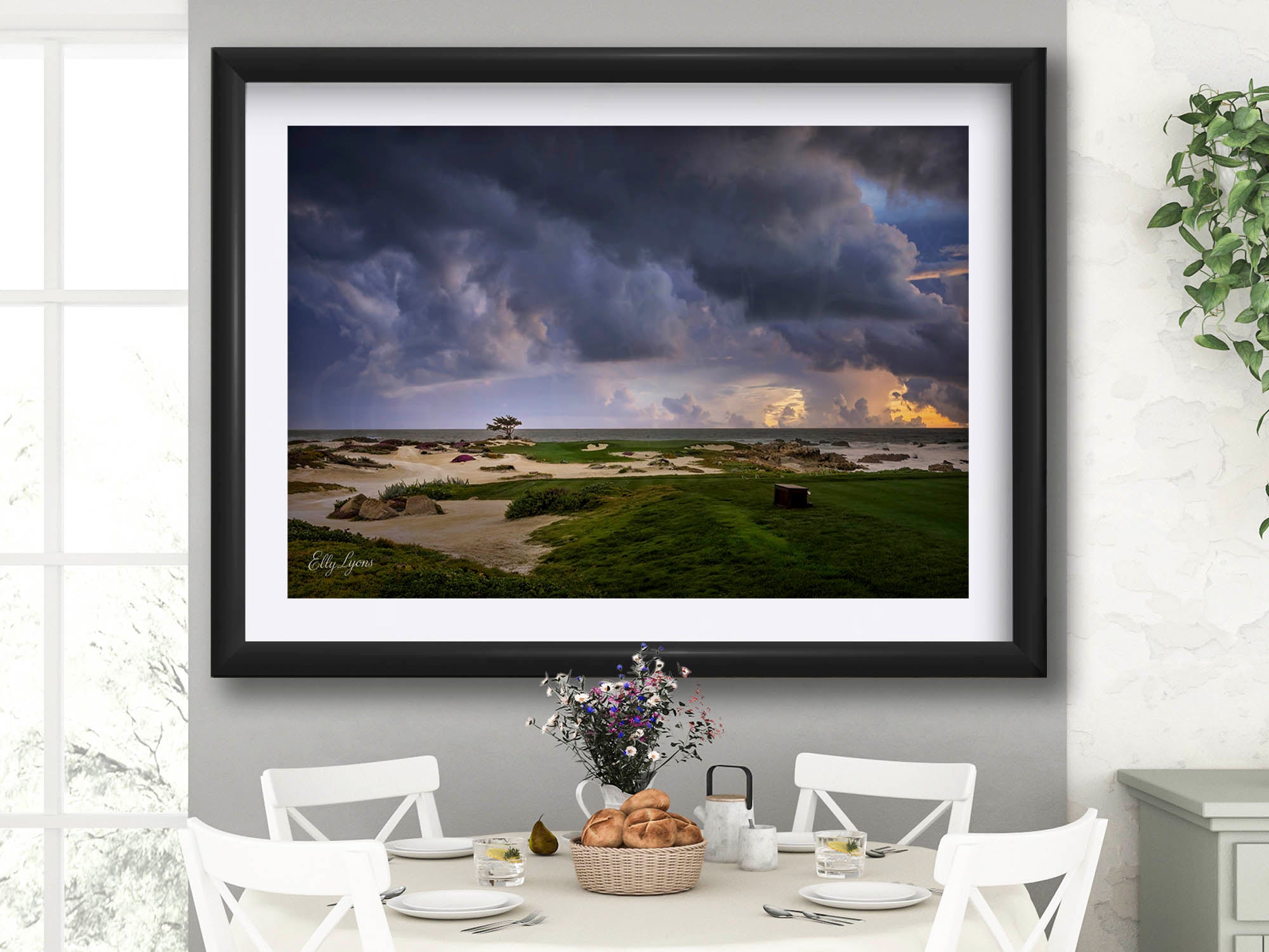 Monterey Golf Club sunset on the green by the ocean shore fine art print styled above a table and chairs in a bright dining room