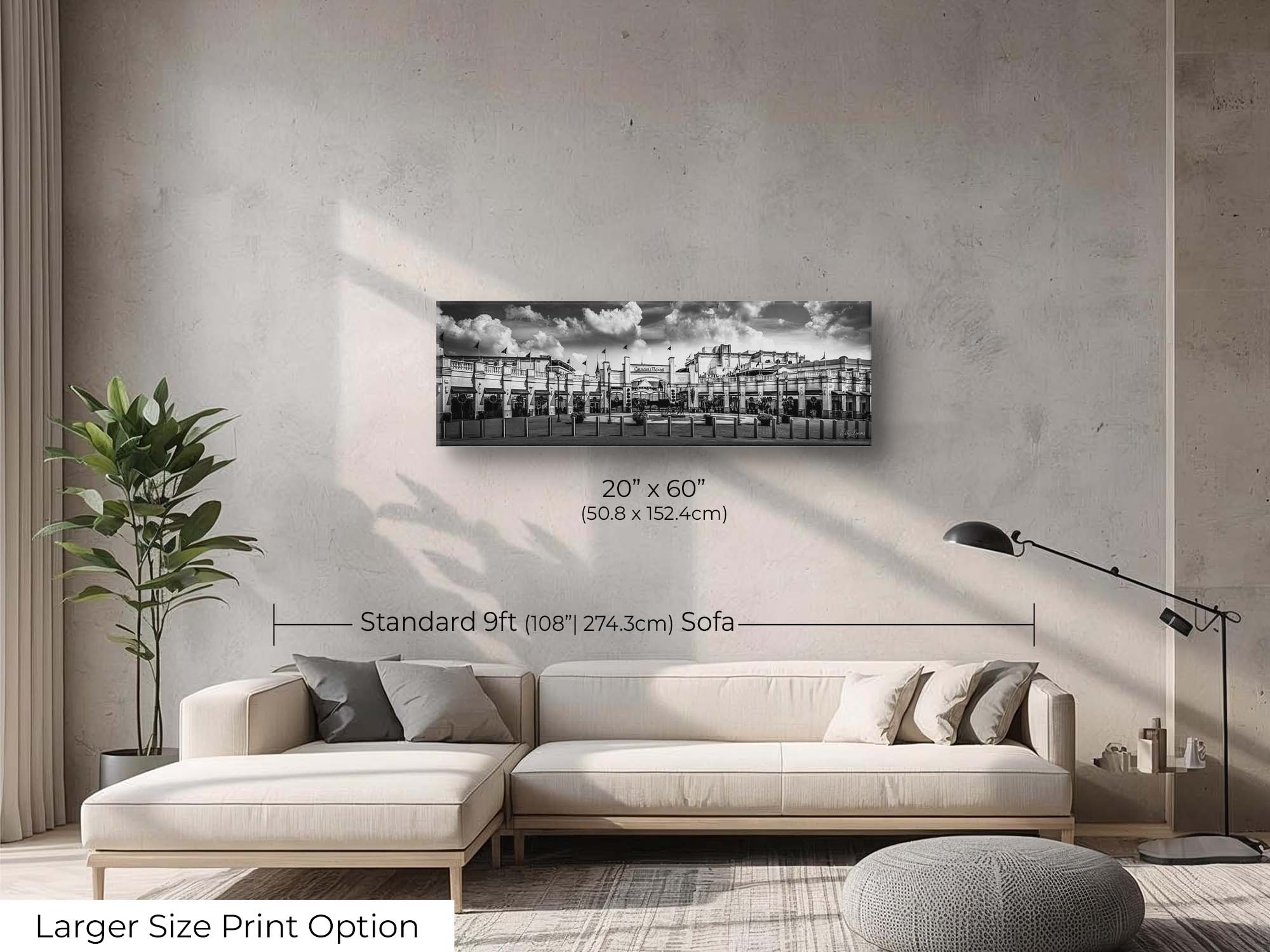 Churchill Downs panoramic black and white fine art print wall art size mockup showing a 20x60 inch print above a nine foot sofa 