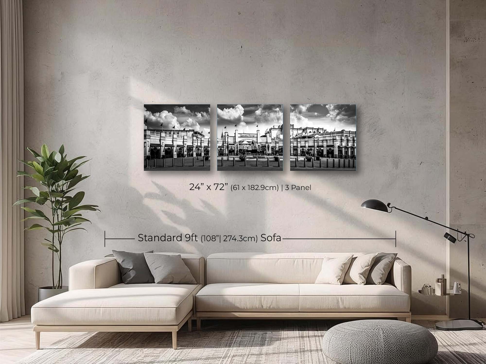 Churchill Downs panoramic black and white fine art print wall art size mockup showing a 24x72 inch 3 panel print above a nine foot sofa 