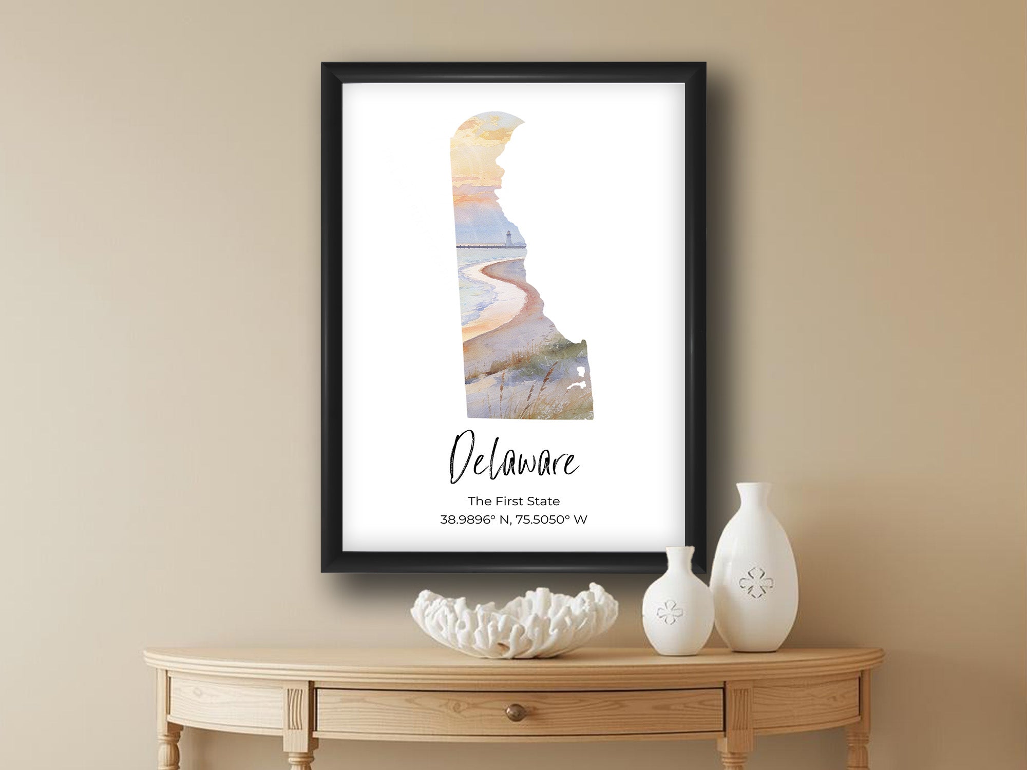 Delaware watercolor state map with Cape Henloath wall art print in black frame styled above a wooden table in a bright entryway