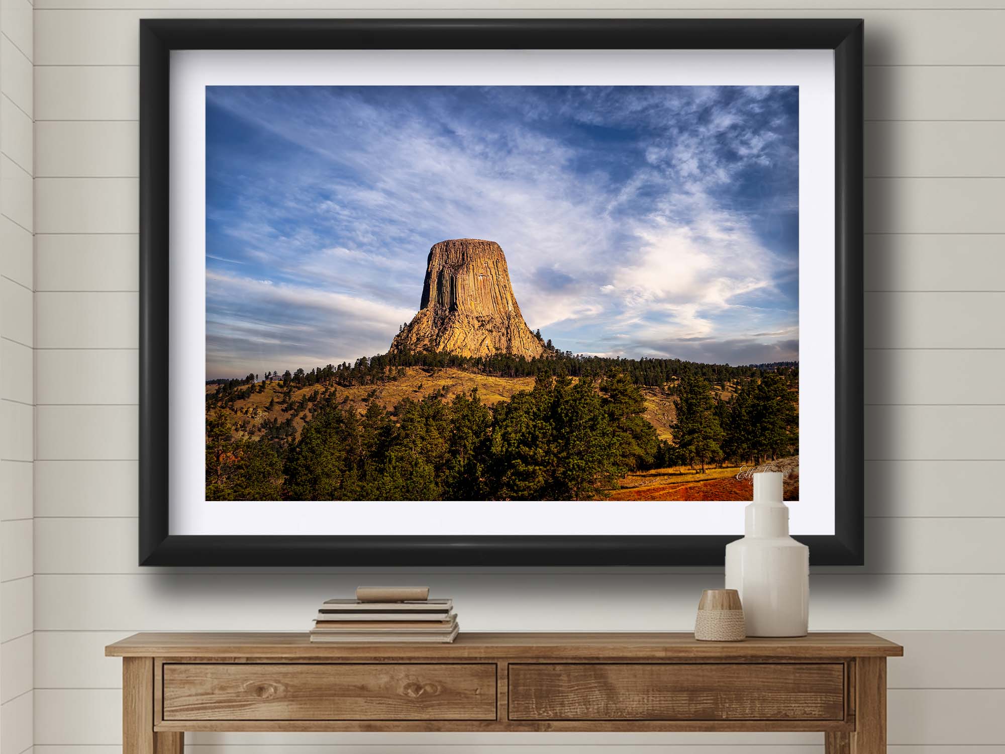 Devil’s Tower Wyoming sunset fine art print in black frame styled above a table in a bright entryway