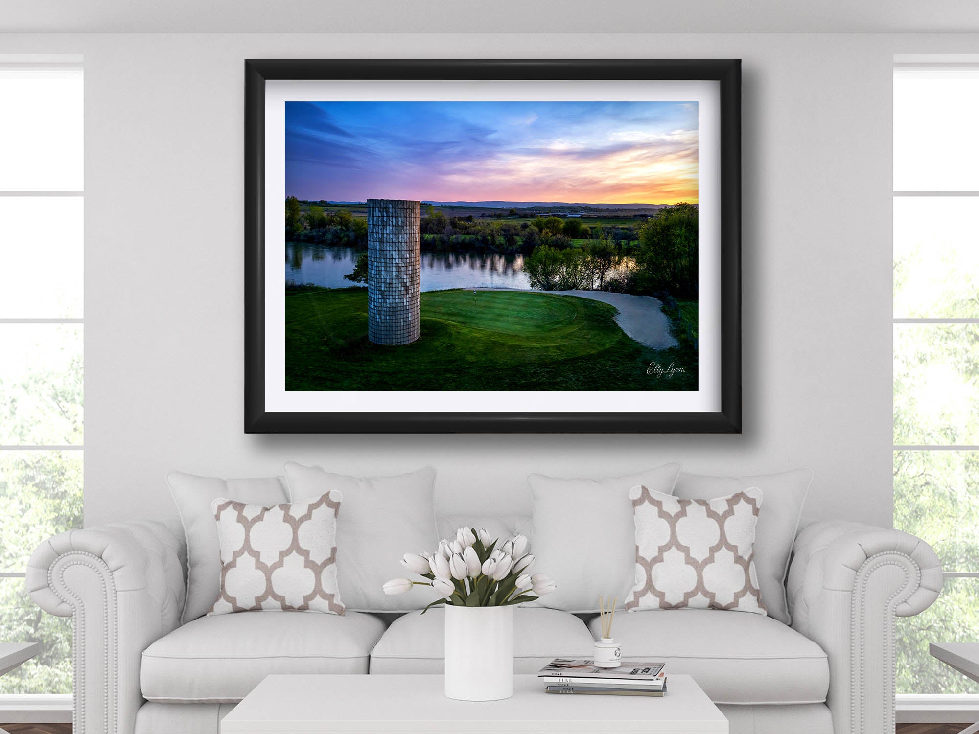 Riverbend Golf Club in Idaho, silo green sunset by the river fine art print in black frame styled above a sofa in a bright living room