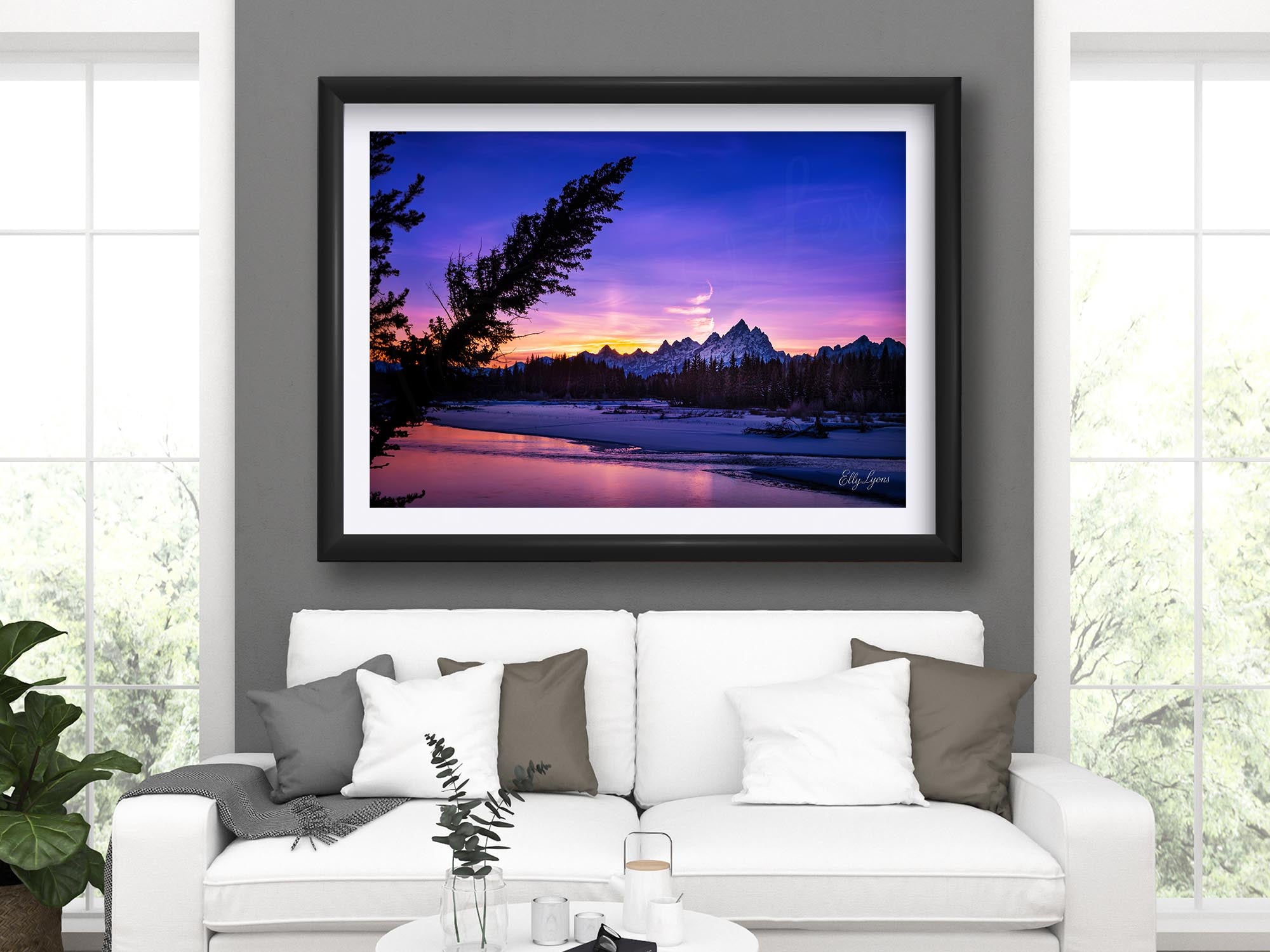 Grand Teton National Park, Snake River sunset fine art print in black frame styled above a sofa in a bright living room