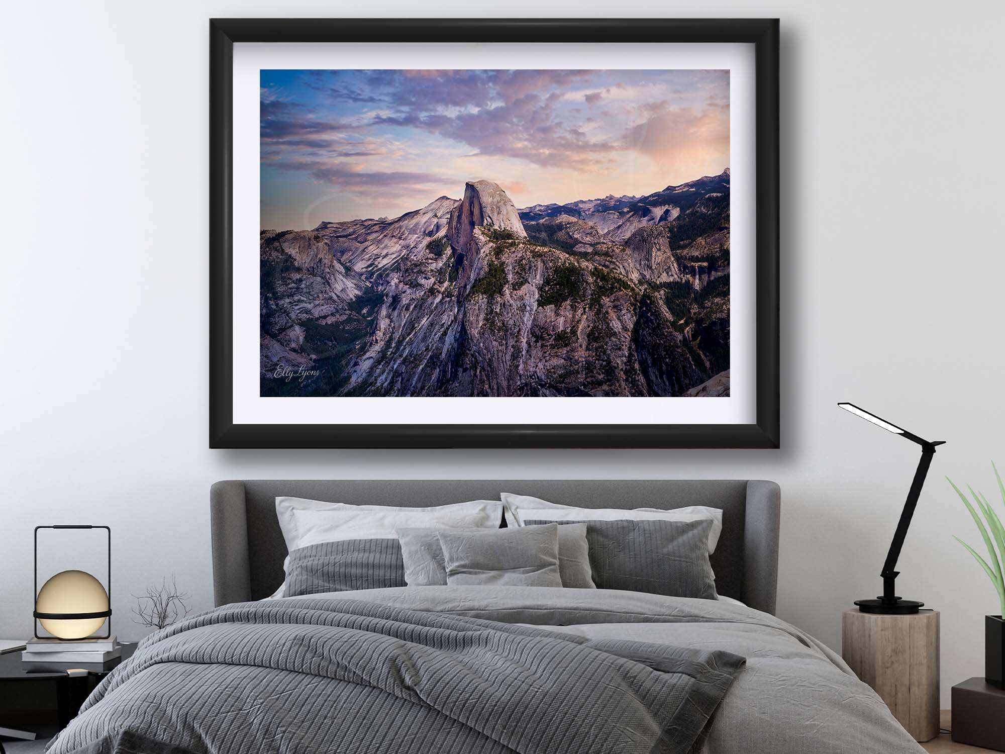 Yosemite National Park, Half Dome sunrise fine art print in black frame styled above a bed in a bright bedroom