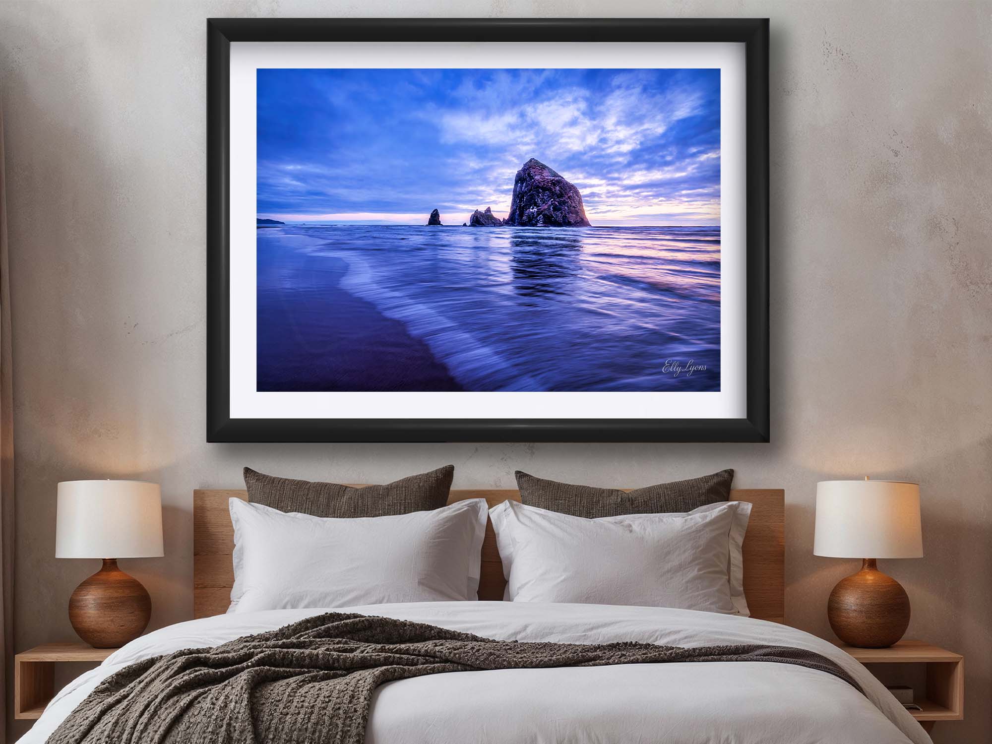 Oregon Coast Canon Beach sunset fine art print in black frame styled above a bed in a bright bedroom