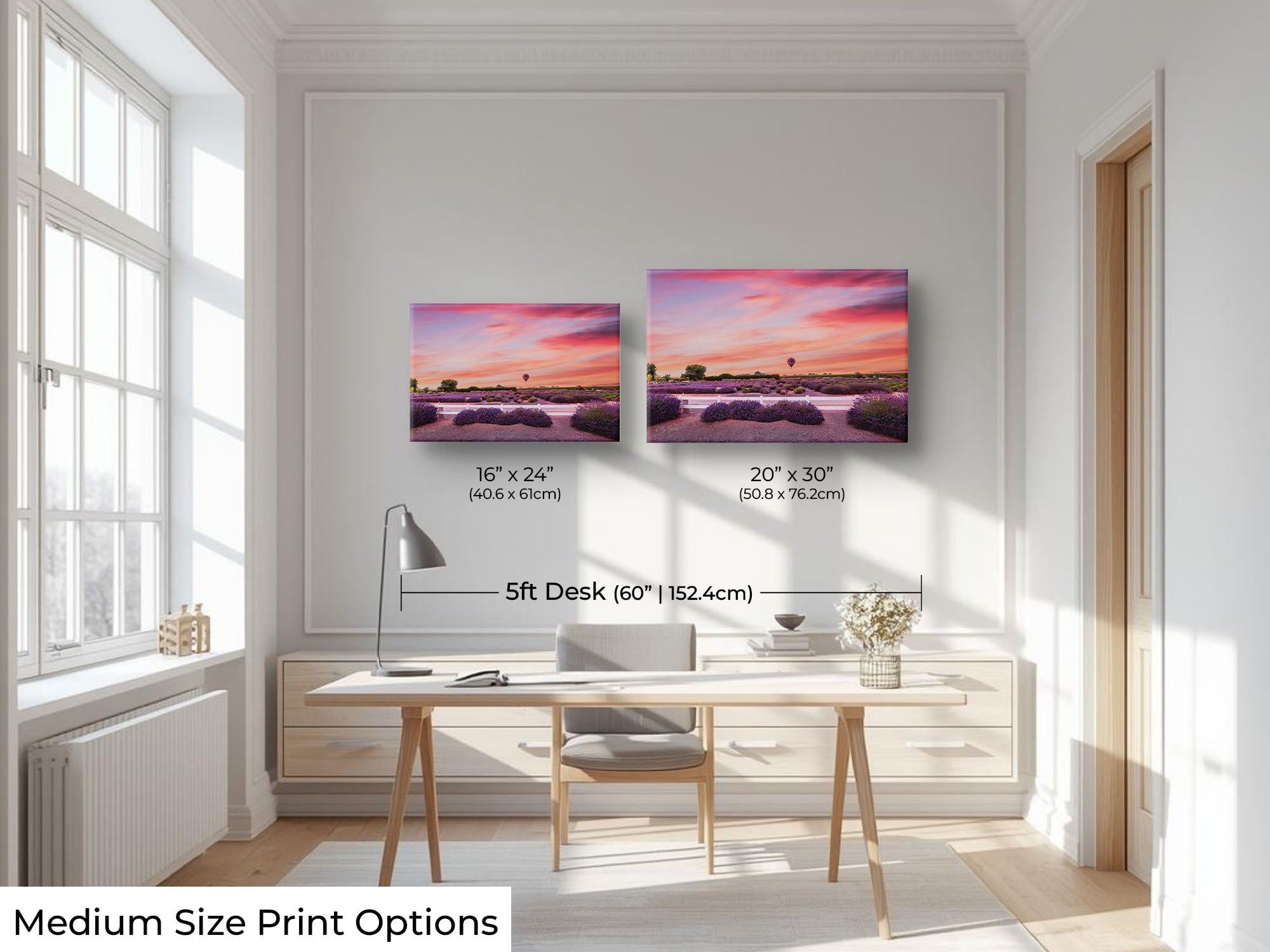 A hot air balloon over a lavender field during sunset fine art print wall art size mockup showing 16x24 and 20x30 inch prints above a five foot office desk and chair in a bright office 