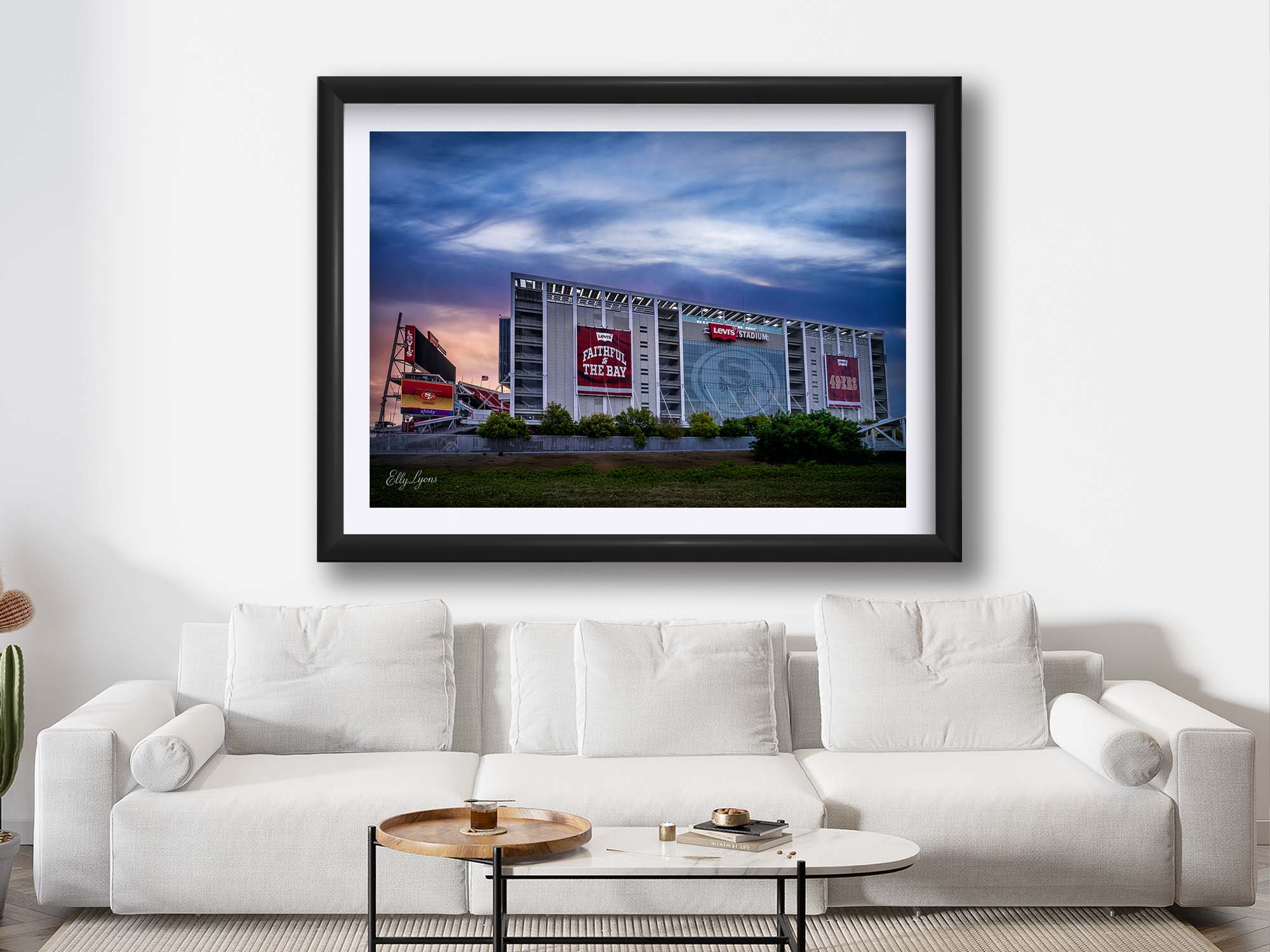 Levi’s Stadium sunrise fine art print in black frame styled above a sofa in a bright living room