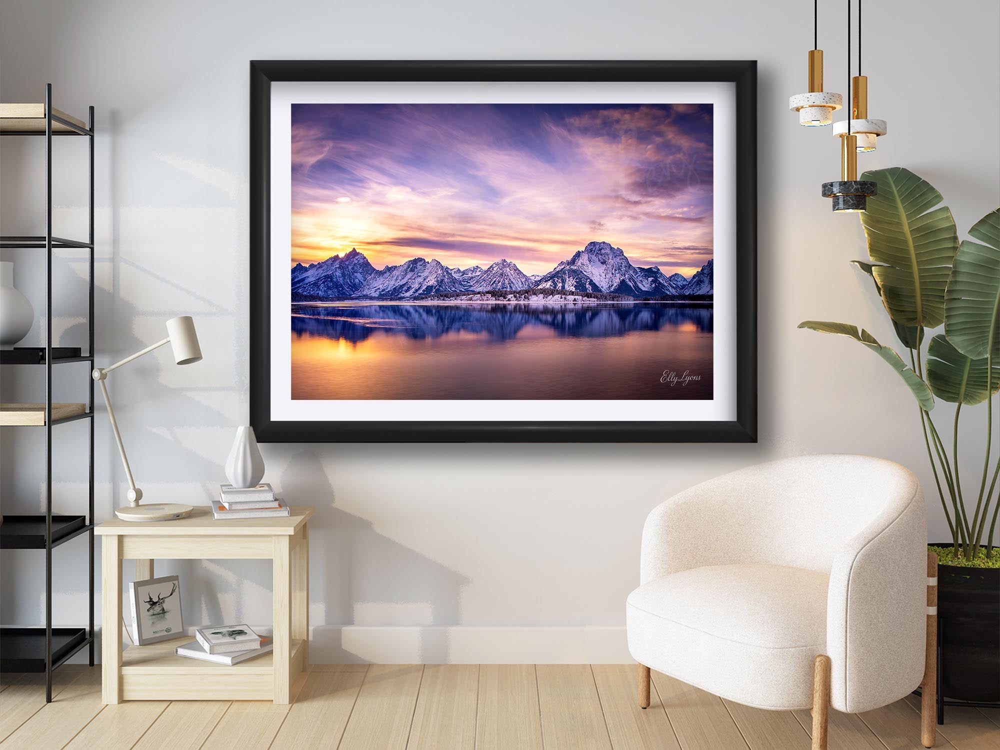 Grand Teton National Park, Mount Moran reflection sunset fine art print in black frame styled above a reading chair in a bright reading nook