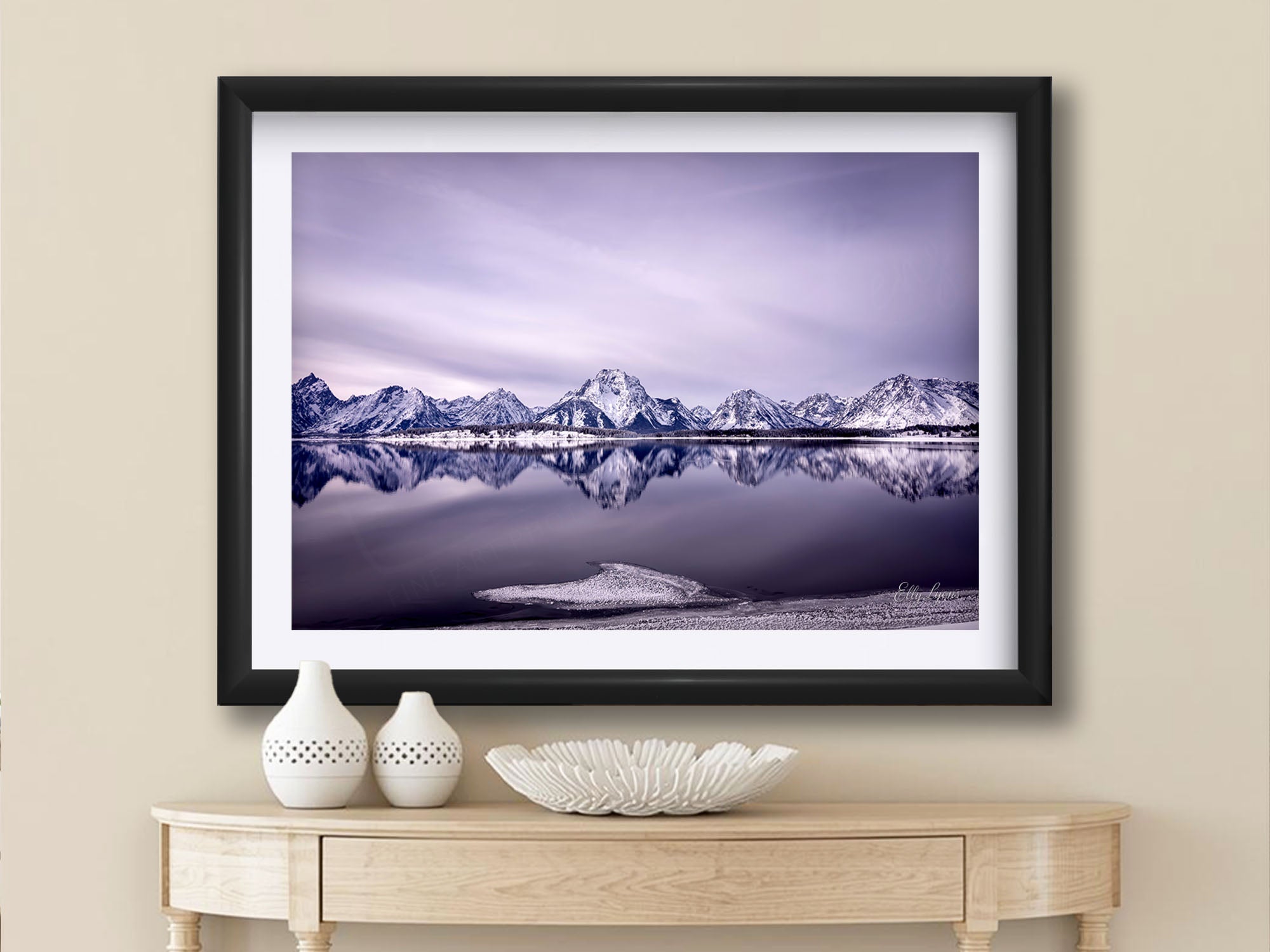 Grand Teton National Park, snow capped mountain sunset fine art print in black frame styled above a table in a bright entryway