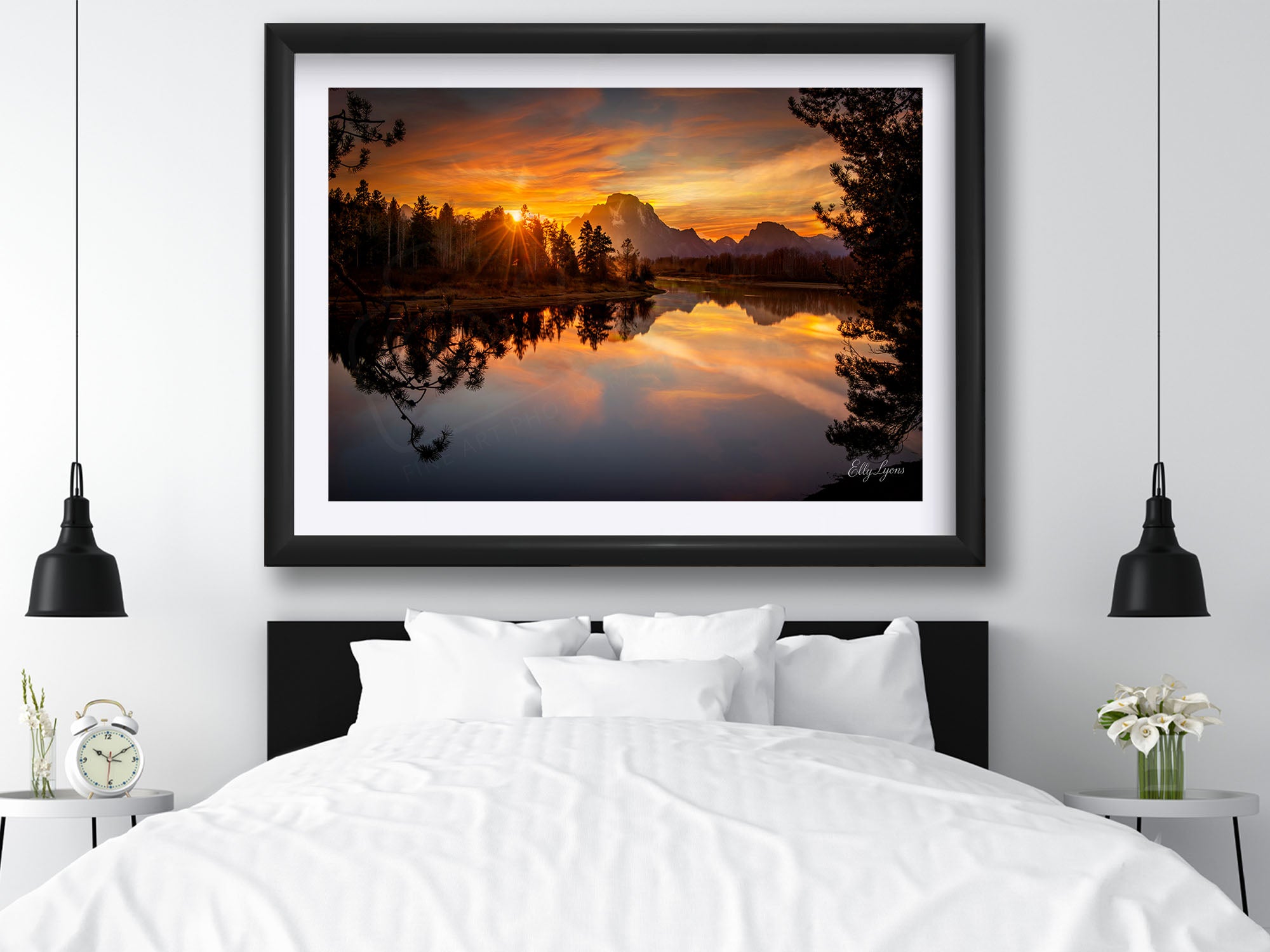 Grand Teton National Park, Oxbow Bend sunset fine art print in black frame styled above a bed in a bright bedroom