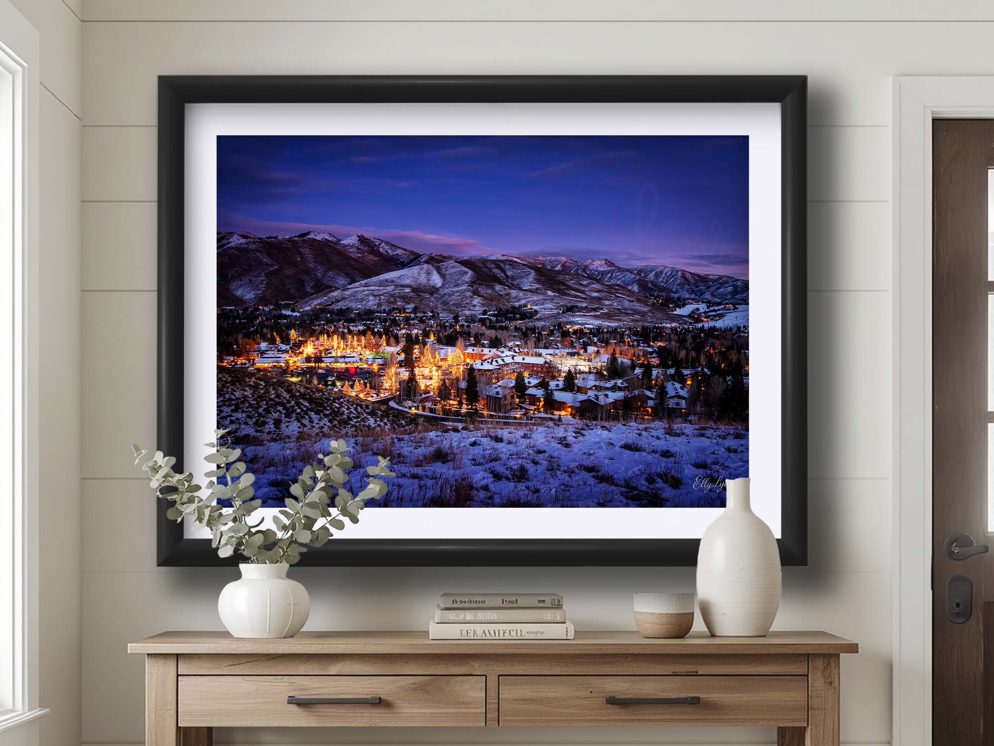 Sun Valley Idaho Christmastime sunset fine art print in black frame styled above a table in a bright entryway