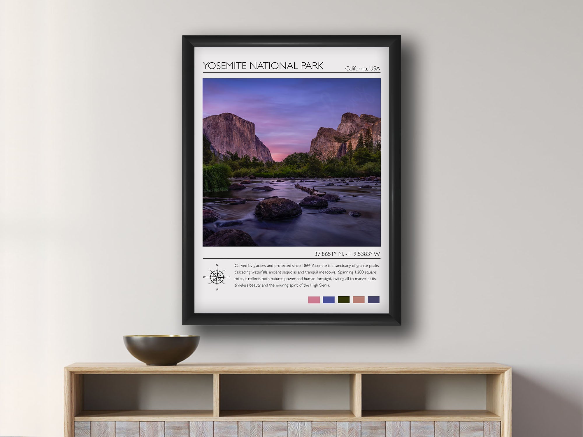 Yosemite National Park travel poster featuring El Capitan photograph and photo inspired color palette in black frame styled above a console in a bright dining room